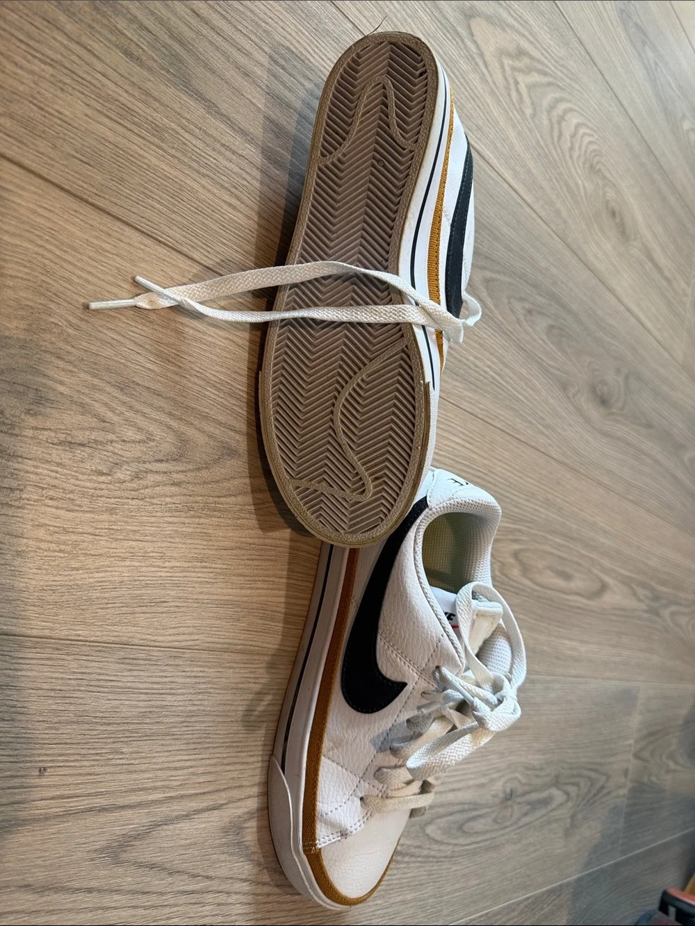 Nike White Sneakers with Black Swoosh and Brown Trim
